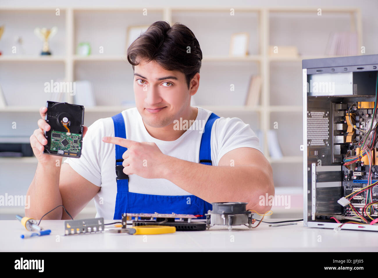 Computer repairman repairing desktop computer Stock Photo - Alamy