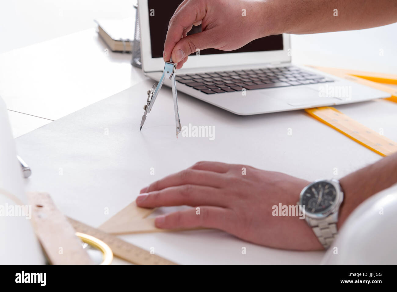 Male engineer working on drawings and blueprints Stock Photo Alamy