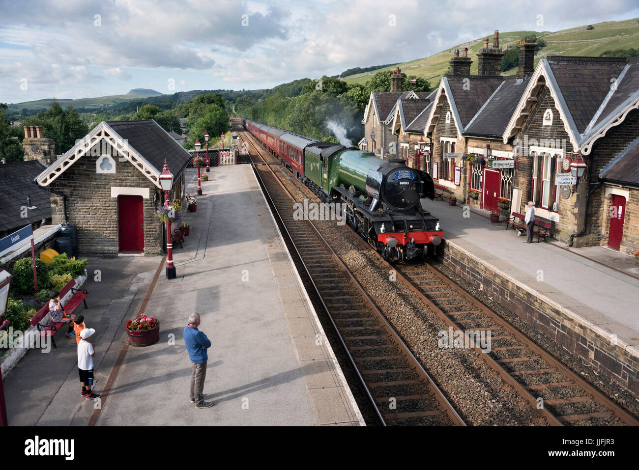 The Flying Scotsman steam locomotive passes through Settle Station, North,Yorkshire, UK Stock Photo