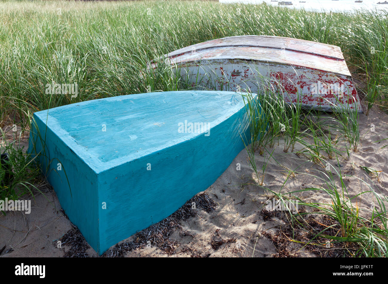 Boats (a slow and a dory) in the sand and grass beachside on Cape Cod. Stock Photo