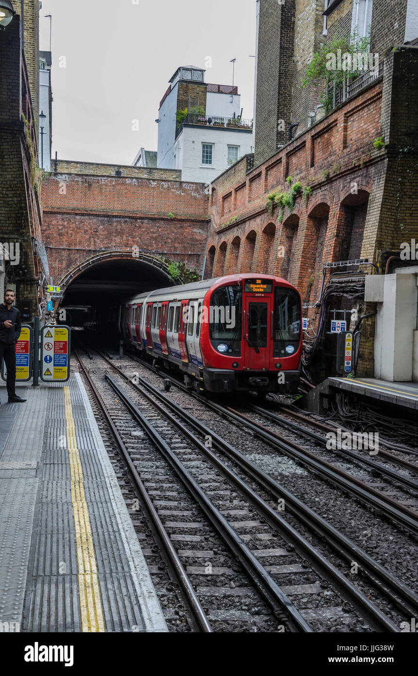 A train arrives in Notting Hill Gate London Underground station Stock