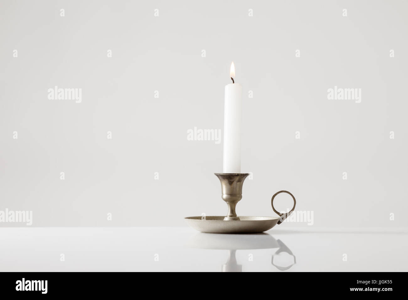 Candle stick holder on white background Stock Photo - Alamy
