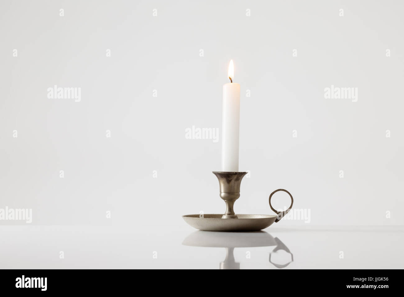 Candle stick holder on white background Stock Photo - Alamy