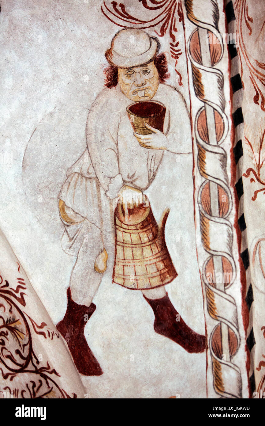 Danish nedieval religious fresco in Undloese Church depicting a drunkard by the Isefjord Master from around year 1450 A.D. Typical for the Isefjord Ma Stock Photo