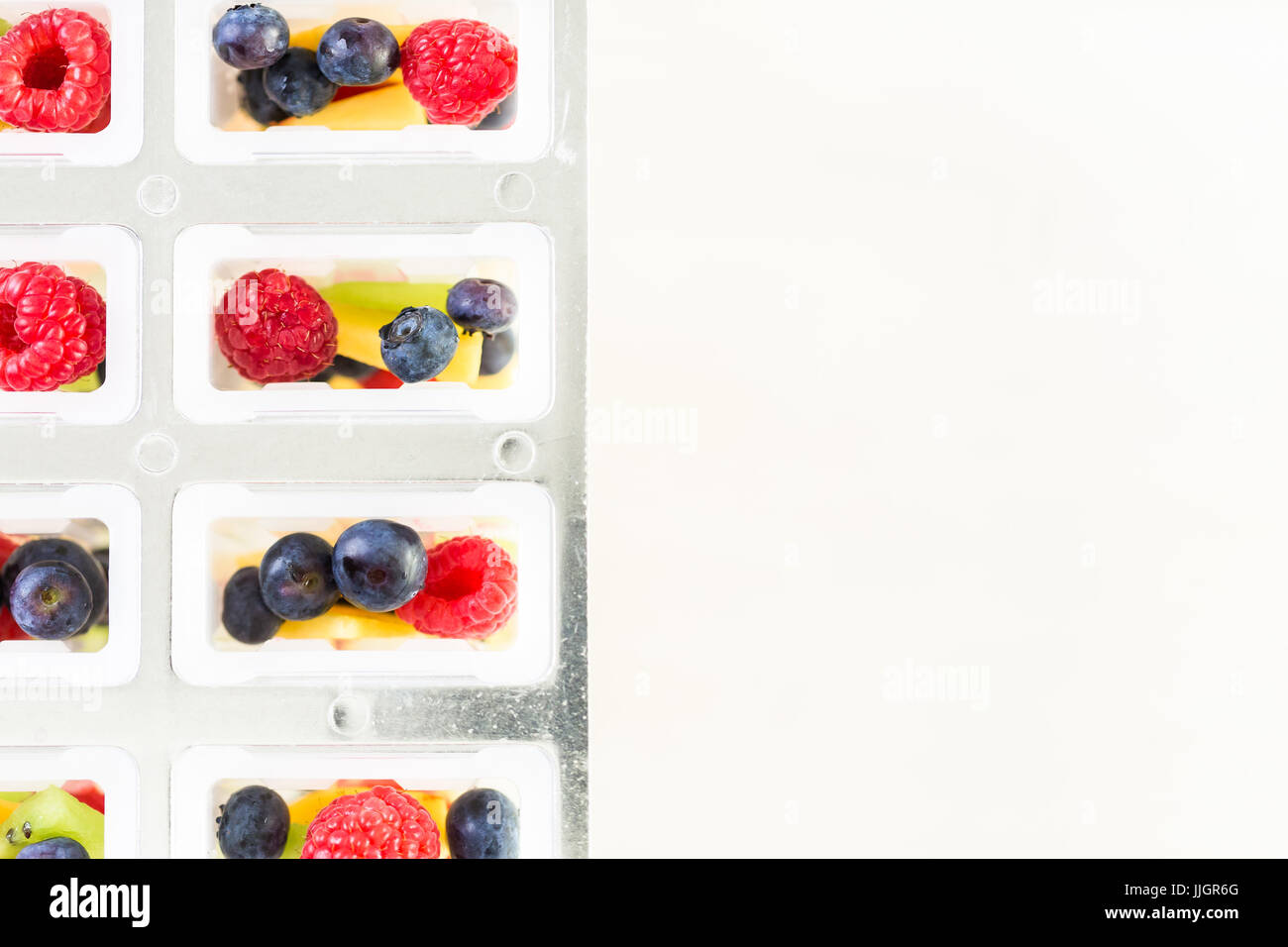 Making homemade fresh fruit popsicles with apple juice Stock Photo Alamy