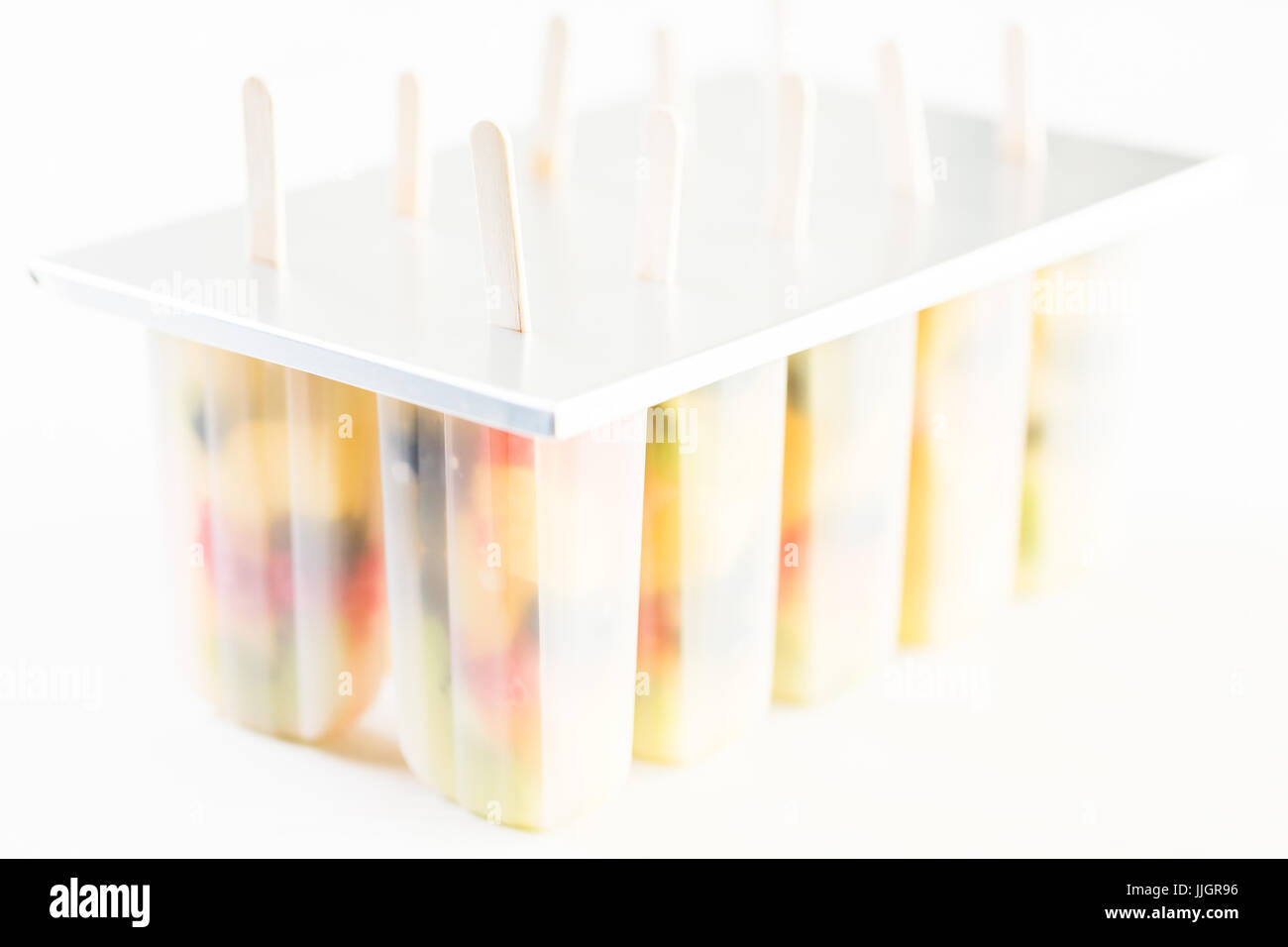 Making homemade fresh fruit popsicles with apple juice Stock Photo Alamy