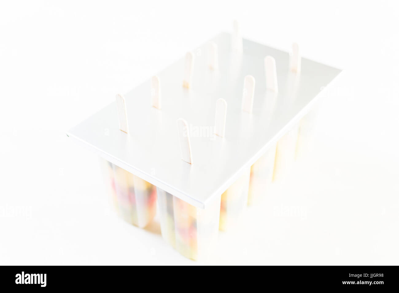 Making homemade fresh fruit popsicles with apple juice Stock Photo Alamy