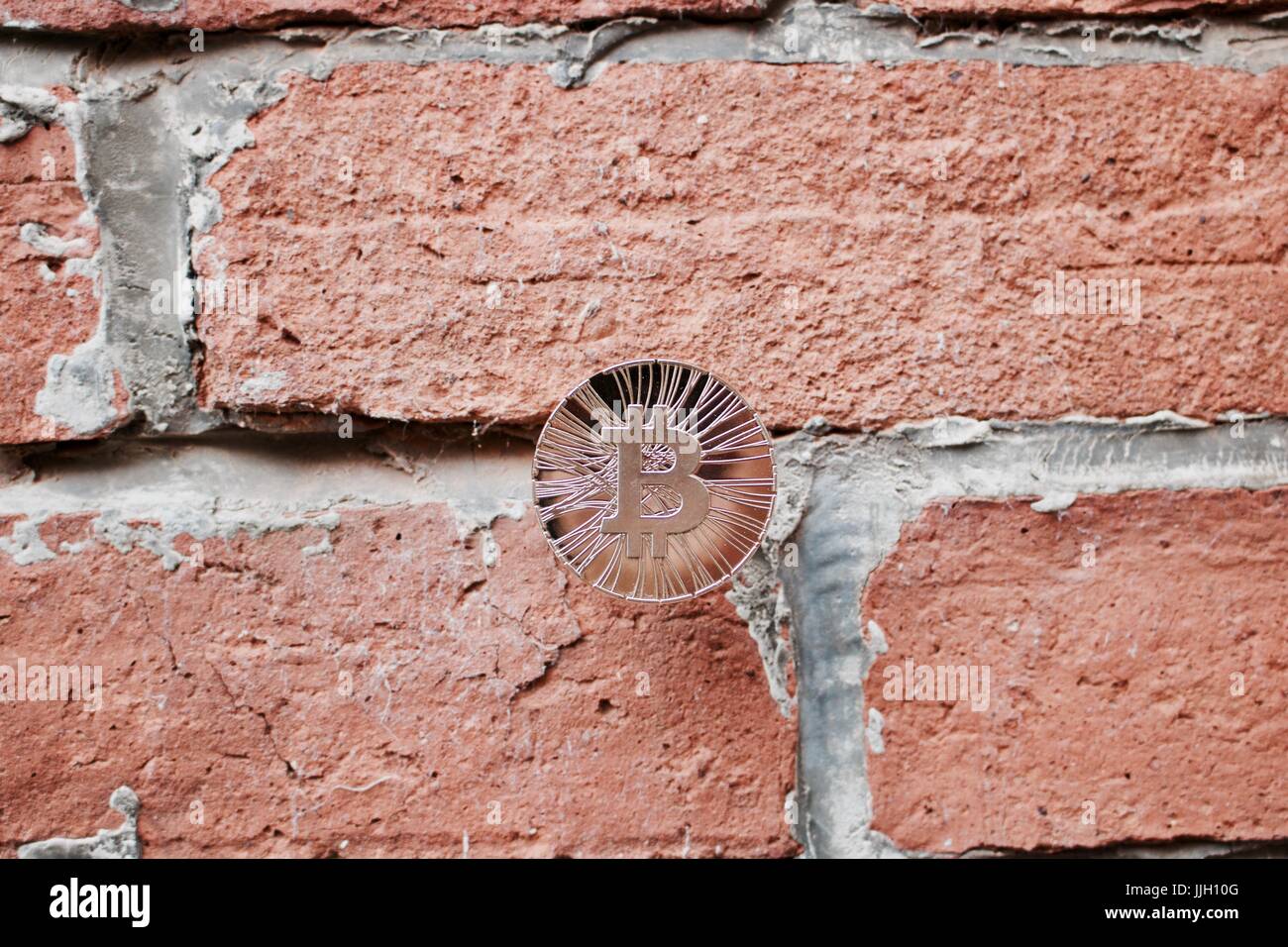 Digital currency physical gold bitcoin coin on brick wall. Business concept  Stock Photo - Alamy