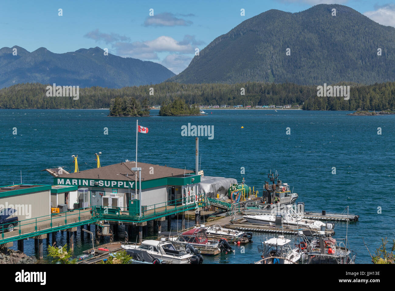 Marine supply store and dock in Tofino, across from Meares Island Stock