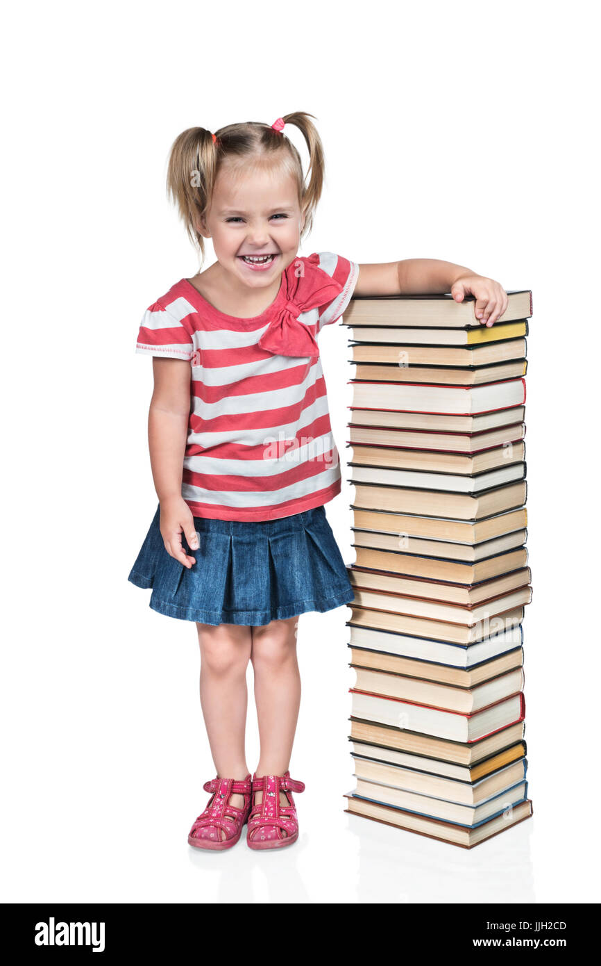 Child leaned against a pile of books Stock Photo - Alamy