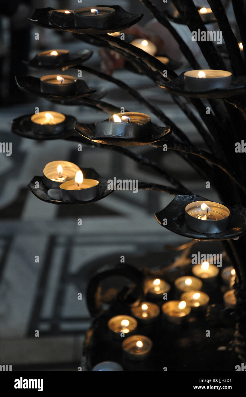 Church candles burning in remembrance Stock Photo Alamy