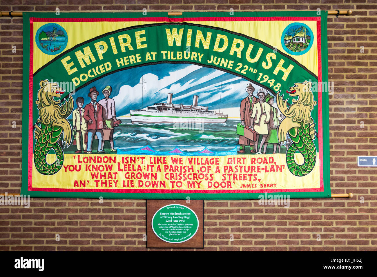 An Empire Windrush commemorative flag and plaque at the London Cruise Terminal at Tilbury, Essex, England, U.K. Stock Photo