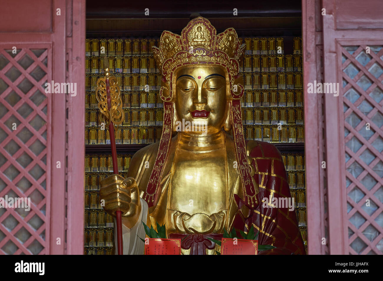 Closeup of Golden Buddha statue in Dafo Temple (also Big Buddha Temple), one of Guangzhou's most popular temples - Guangzhou, China Stock Photo