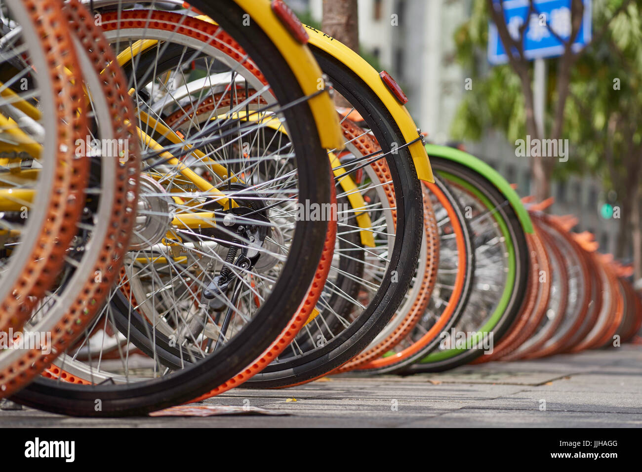 Bicycle wheels - rental share hire bikes in Guangzhou City, China Stock Photo