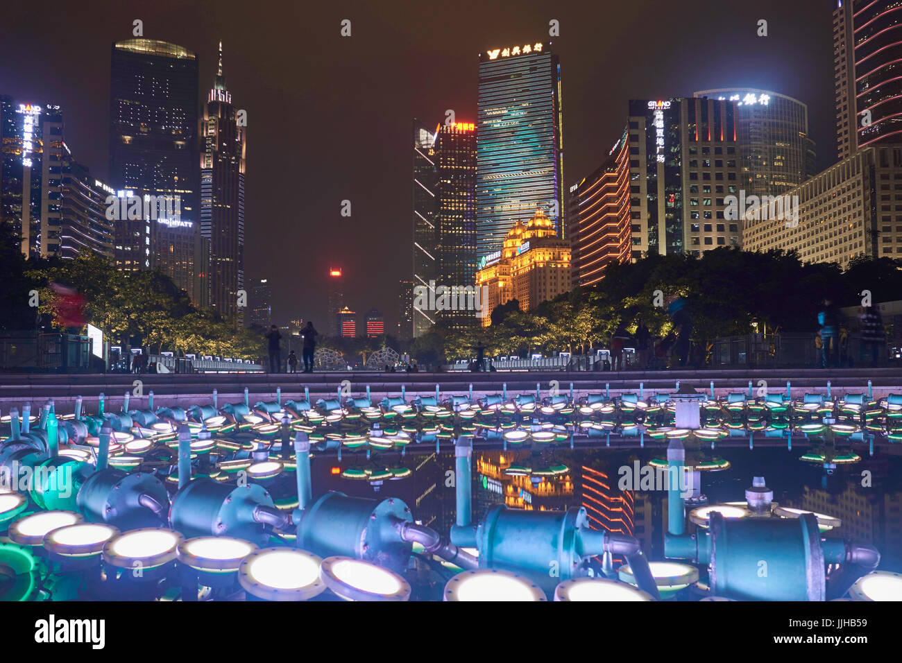Huacheng Square fountain lights at night and nightscape with skyscrapers - Guangzhou CBD, China Stock Photo