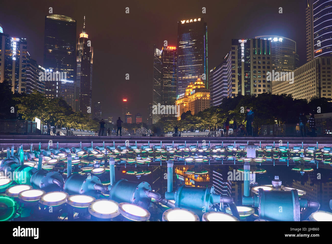 Huacheng Square fountain lights at night and nightscape with skyscrapers - Guangzhou CBD, China Stock Photo