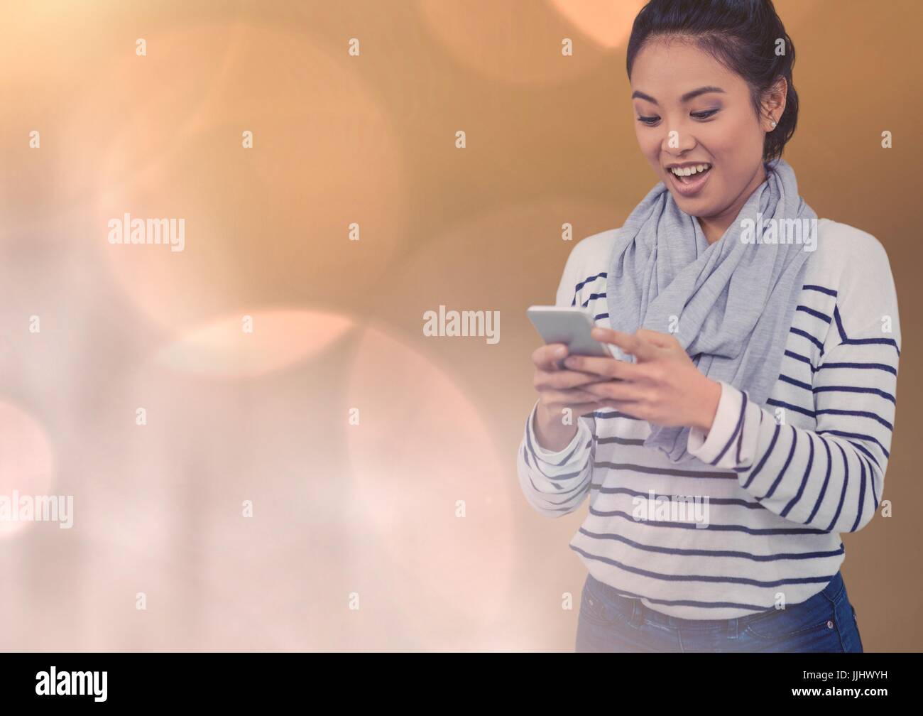 Smiling texting woman in colored fog Stock Photo Alamy