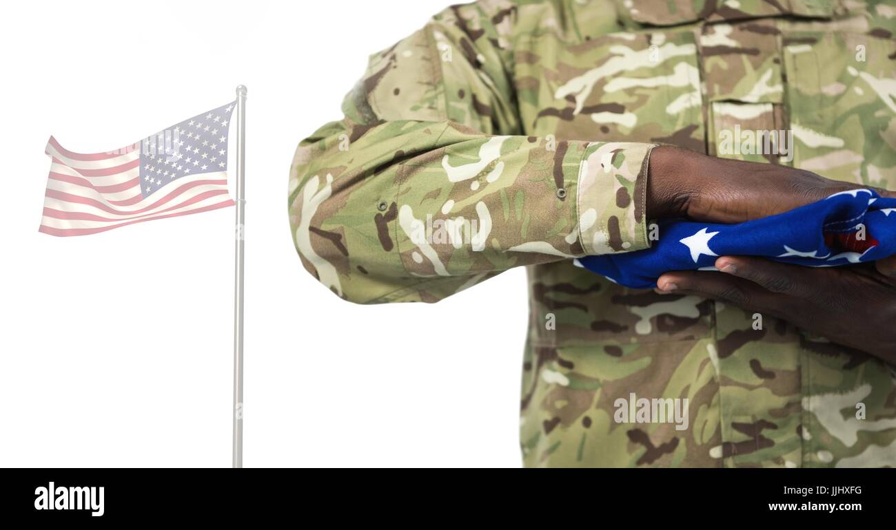 Soldier holding the american flag in front of white background Stock ...
