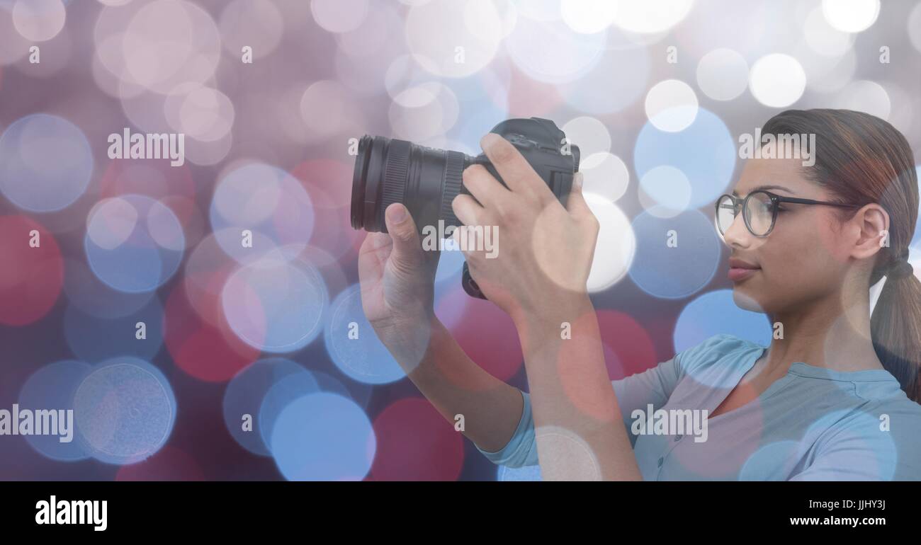 Photographer taking a picture in colored lights Stock Photo Alamy