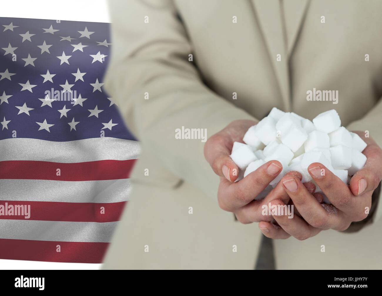Man holding piece of paper in his hands against american flag Stock Photo