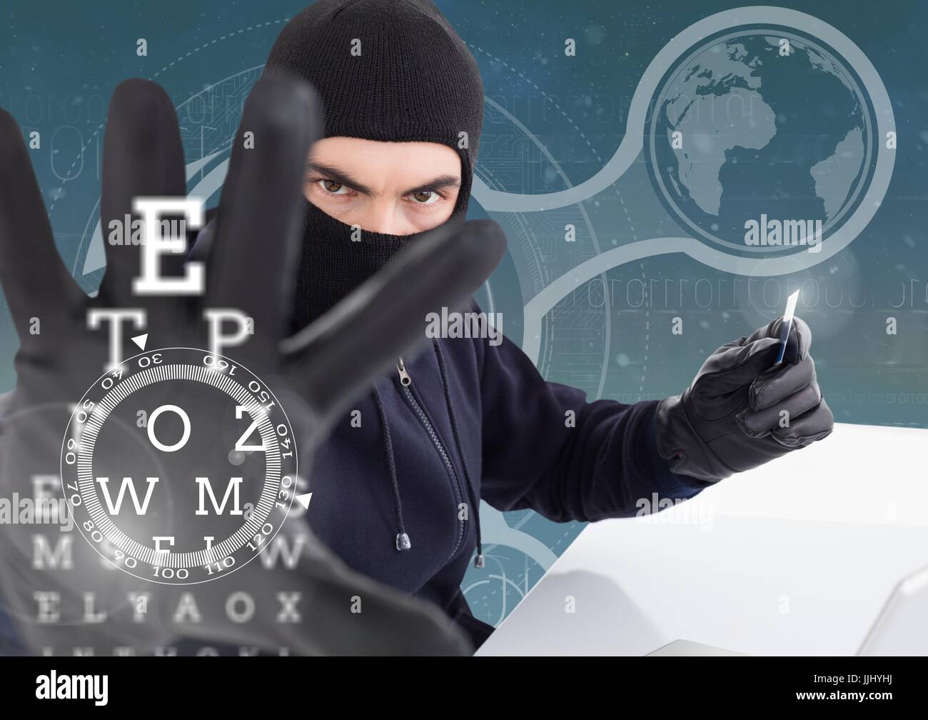 Hacker holding a credit card and extending his arm in front of digital ...