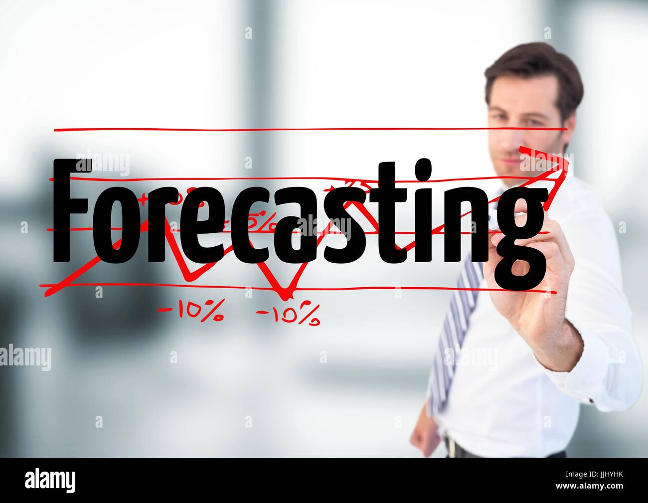 Businessman writing FORECASTING with graph, on the screen. he is in the ...