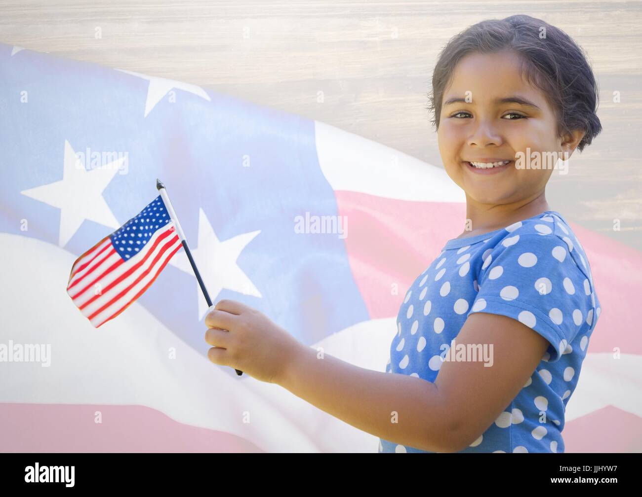 Little girl holding american flag against american flag Stock Photo - Alamy