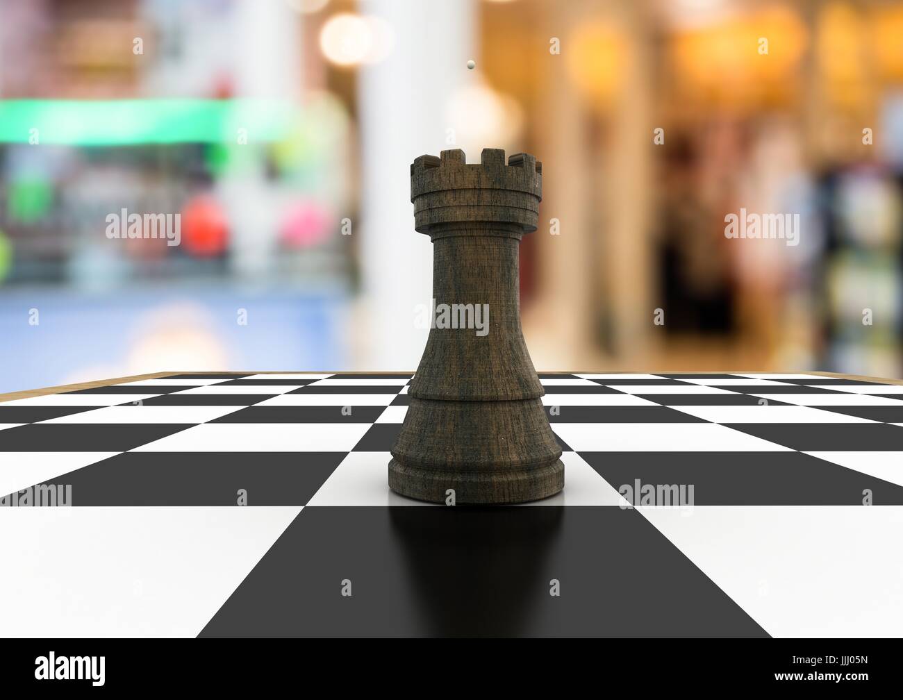 3D Chess piece against blurry background Stock Photo