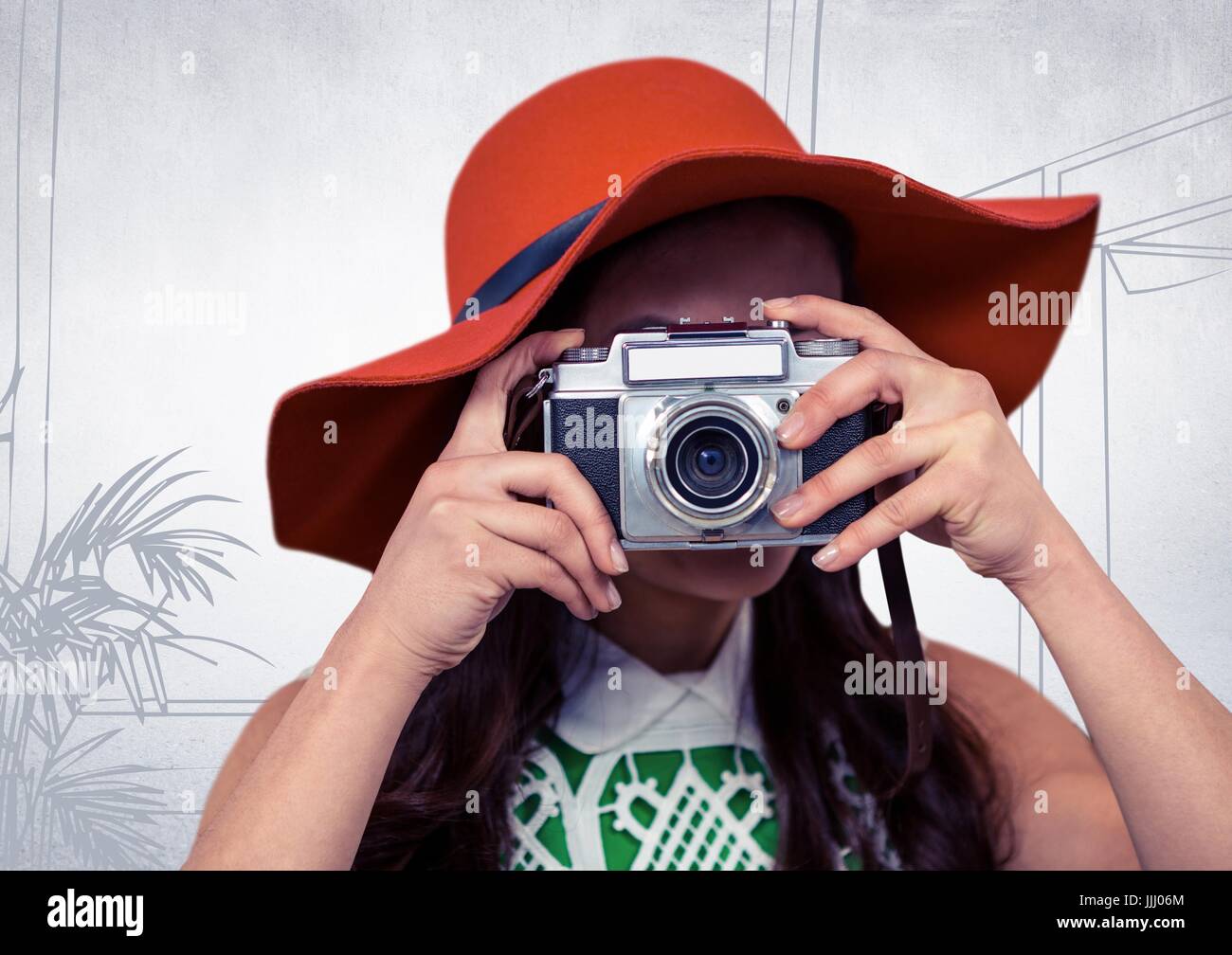 Millennial woman with sunhat and camera against white hand drawn office Stock Photo