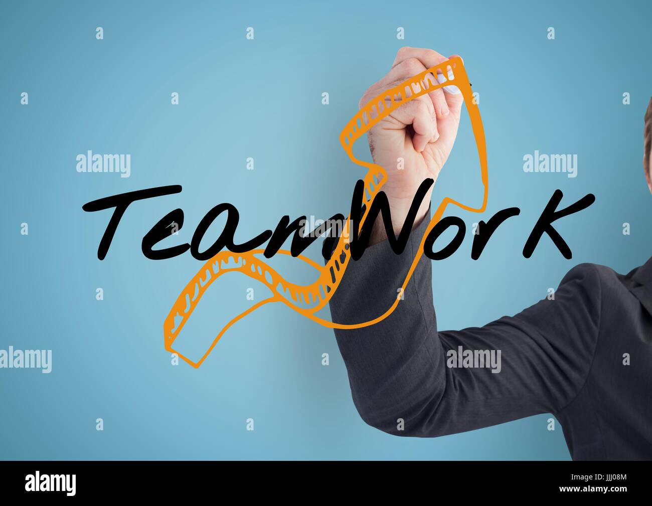 Businessman hand finishing the arrow of the graphic about TEAM WORK Stock Photo