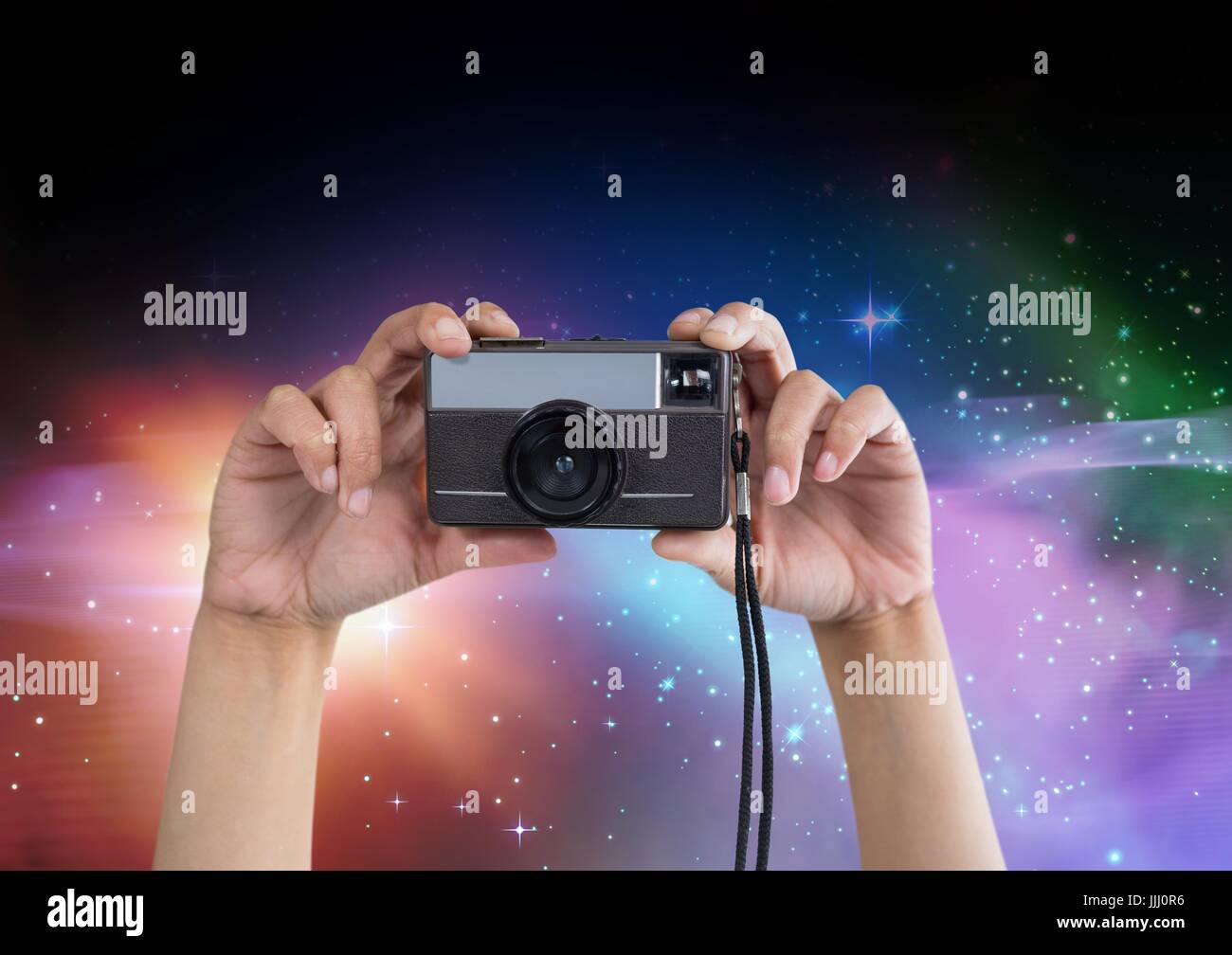 Part of a photographer taking pictures in colored lights Stock Photo