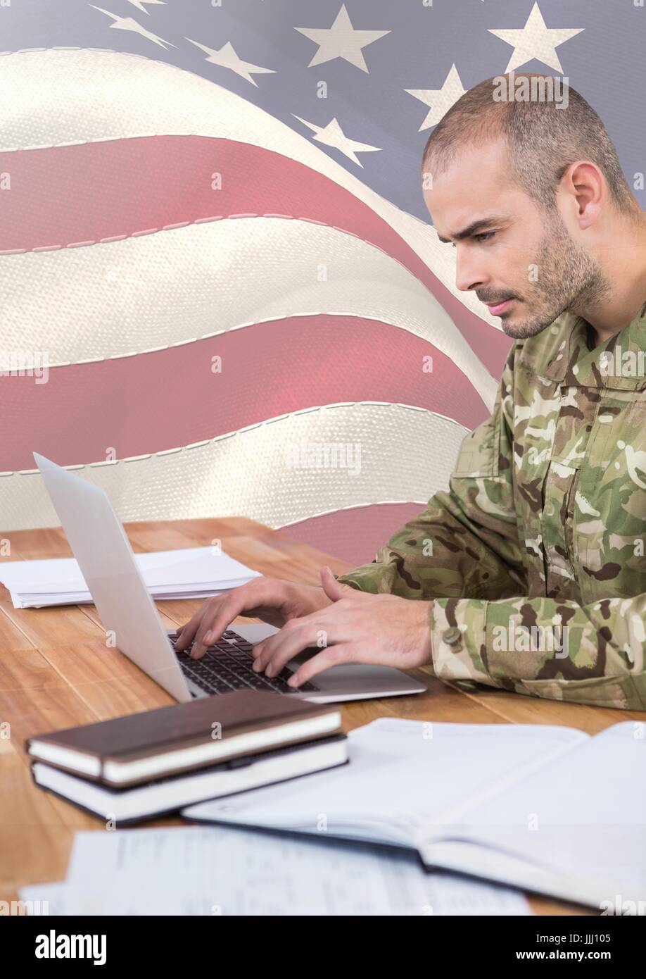 Soldier using a laptop in front of american flag Stock Photo - Alamy