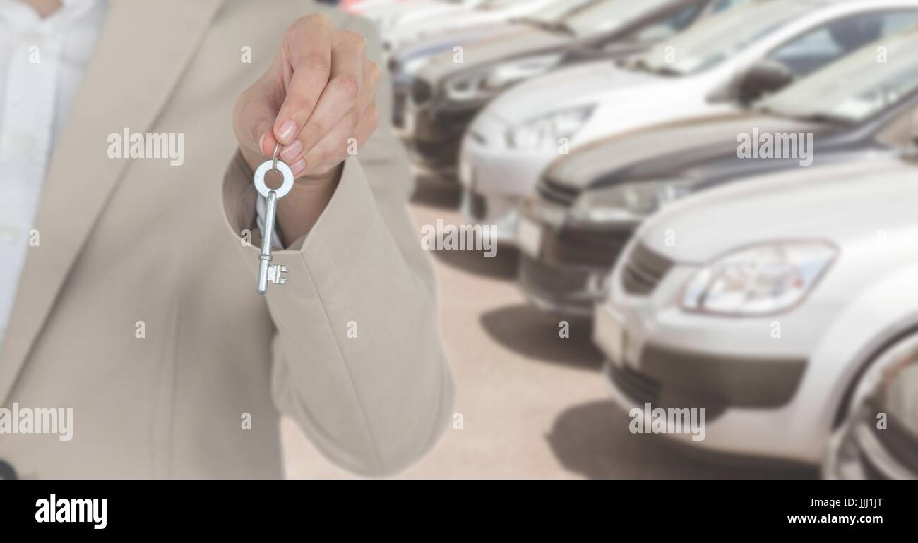 Holding Keys with cars Stock Photo Alamy
