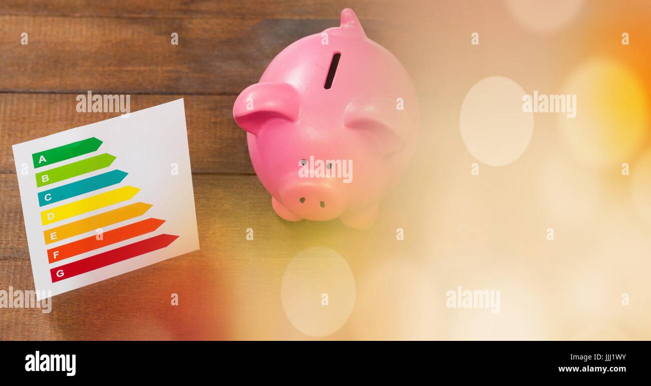 Piggy bank and chart with orange bokeh copy space transition Stock Photo