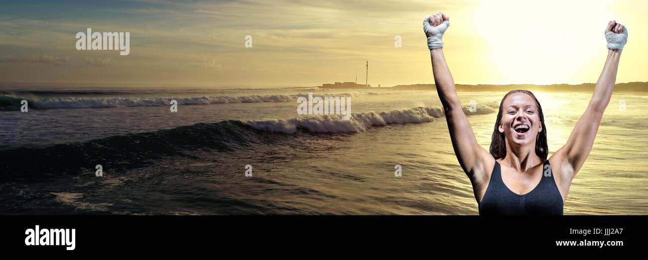 Athlete woman celebrating against waves and sunset 3d Stock Photo