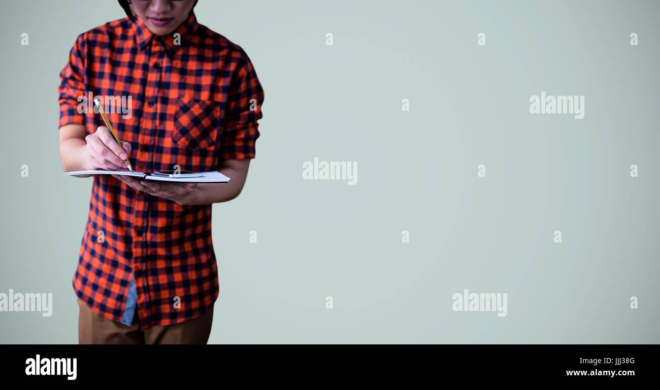 College student with book against light blue background Stock Photo