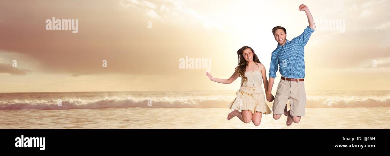 Couple celebrating on sunset beach Stock Photo - Alamy
