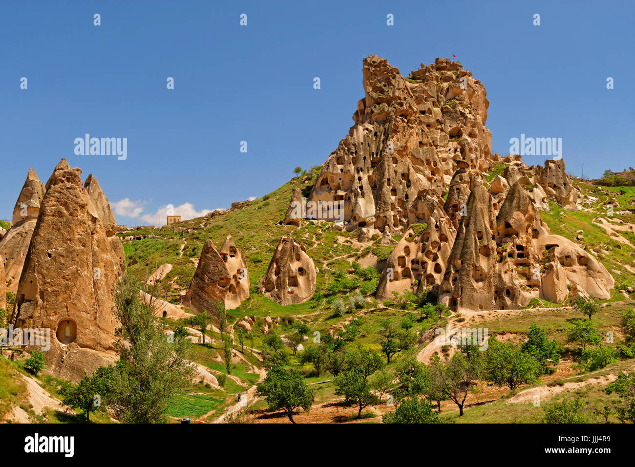 Cave dwellings known as Uchisar Castle at Uchisar in the Goreme National Park, Cappadocia, Turkey. Stock Photo