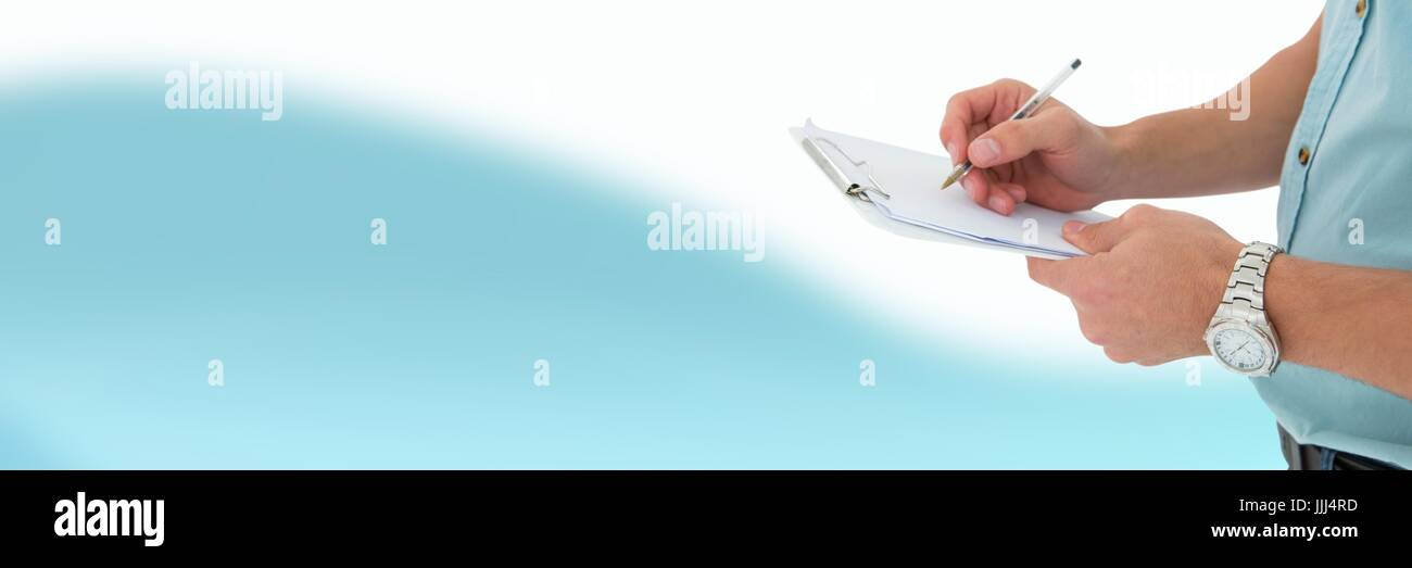Man filling out form writing in front of blurred copy space background Stock Photo