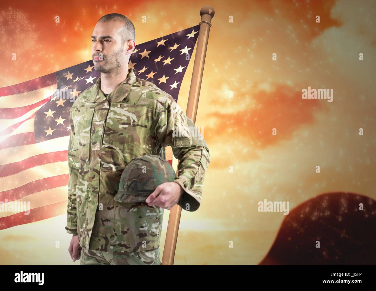 Soldier holding his helmet in front of american background Stock Photo ...