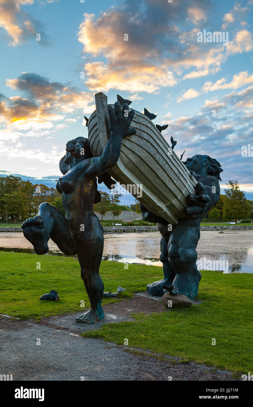 ESTONIA, KURESSAARE, SEPTEMBER 22, 2016: Statues of folk Estonian ?haracters Suur Toll and Piret in Kuressaare. Dawn over Saaremaa island Stock Photo