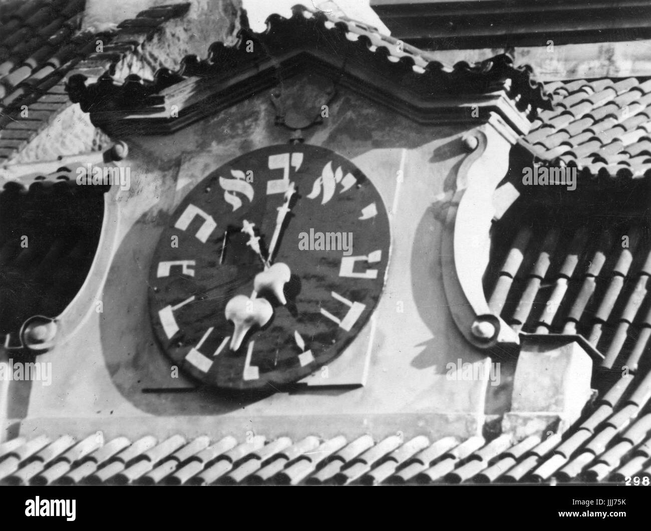 Clock of Jewish Town Hall, Prague. C. 1937. Clockface with Hebrew numerals. Hands of clock move anti- clockwise. Stock Photo