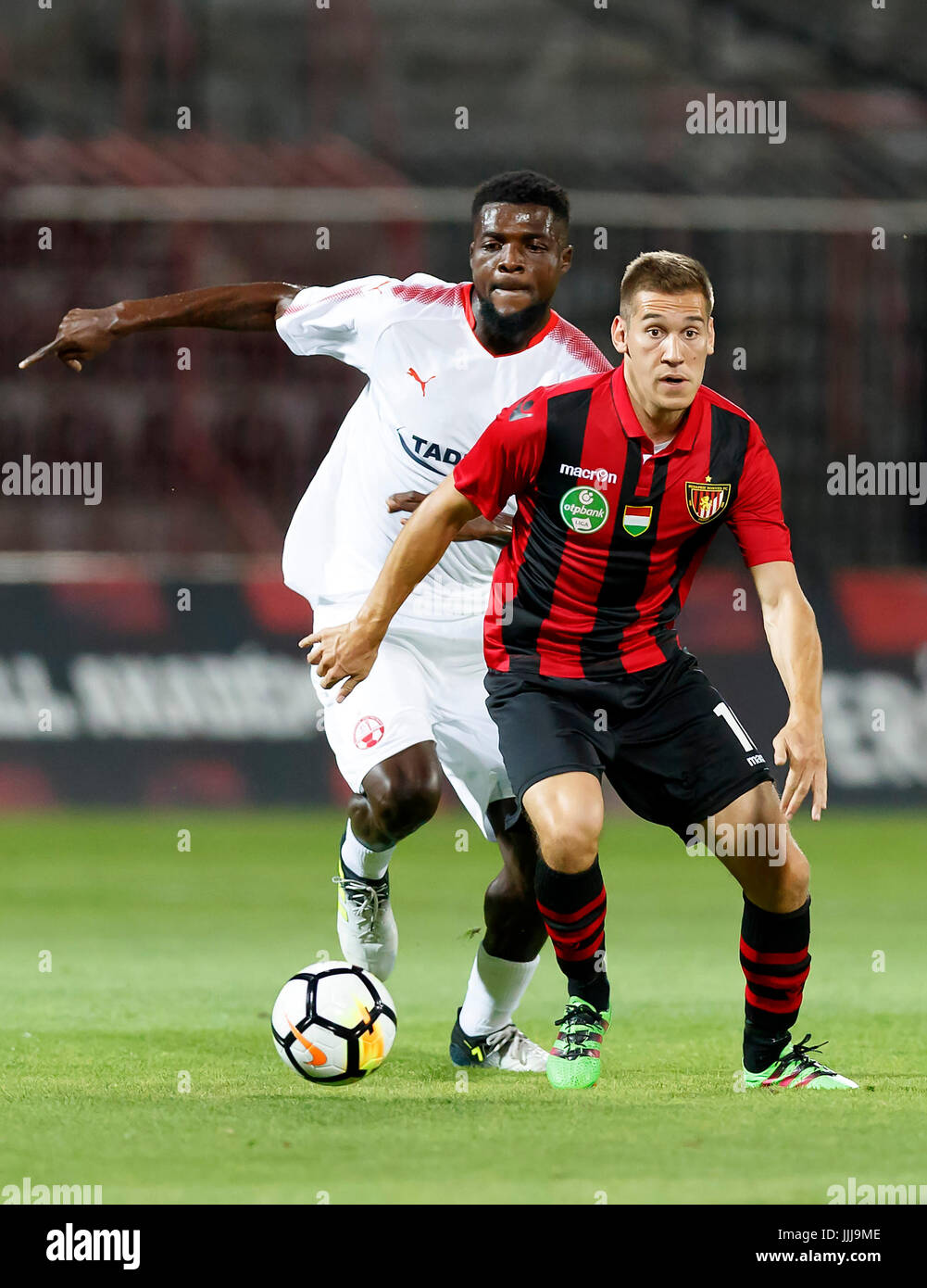 Budapest, Hungary. 19th July, 2017. BUDAPEST, HUNGARY - JULY 19: Zsolt Poloskei (R) of Budapest Honved competes for the ball with John Ogu (L) of Hapoel Beer-Sheva during the UEFA Champions League Second Qualifying Round match between Budapest Honved and Hapoel Beer-Sheva at Bozsik Stadium on July 19, 2017 in Budapest, Hungary. Credit: Laszlo Szirtesi/Alamy Live News Stock Photo