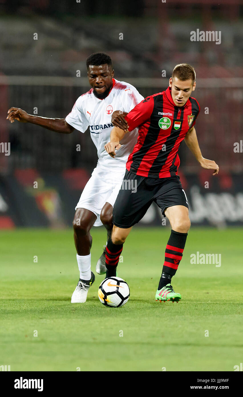 Budapest, Hungary. 19th July, 2017. BUDAPEST, HUNGARY - JULY 19: Zsolt Poloskei (R) of Budapest Honved competes for the ball with John Ogu (L) of Hapoel Beer-Sheva during the UEFA Champions League Second Qualifying Round match between Budapest Honved and Hapoel Beer-Sheva at Bozsik Stadium on July 19, 2017 in Budapest, Hungary. Credit: Laszlo Szirtesi/Alamy Live News Stock Photo