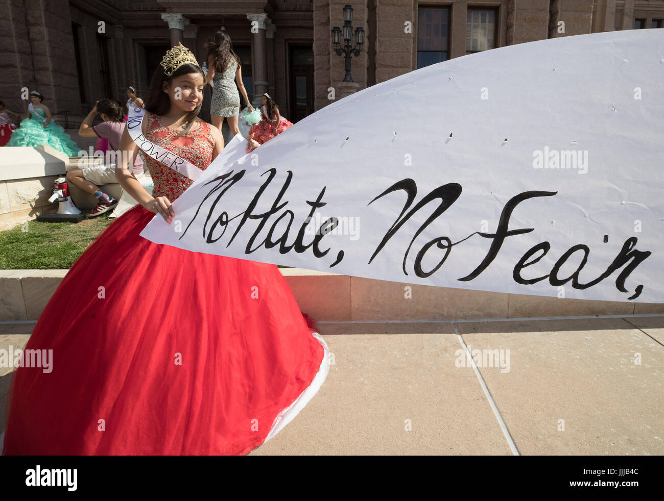 Teen girls wearing Mexican-style quinceanera dresses at the Texas Capitol protest SB4, passed by the legislature and signed by the governor in Spring 2017, a'Show me your papers' bill authorizing police to ask people to prove their immigration status at any time. Stock Photo