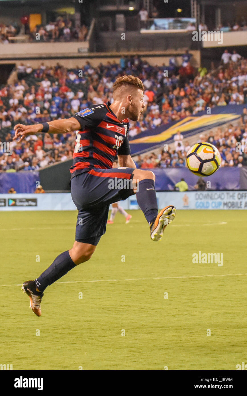 Paul Arriola of the USMNT United States Mens National Team strikes the ball toward the goal during a soccer | football against El Salvador as part of the CONCACAF Gold Cup Stock Photo