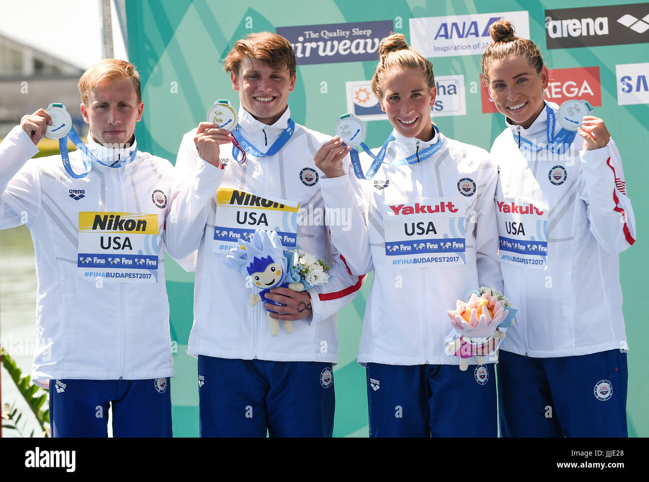 Balatonfuered, Hungary. 20th July, 2017. Jordan Wilimovsky (l-r), Brendan Casey, Ashley Twichell and Haley Anderson of the USA celebrate with their silver medals after the open water 5km team relay event of the FINA World Championships in Balatonfuered, Hungary, 20 July 2017. Photo: Axel Heimken/dpa/Alamy Live News Stock Photo