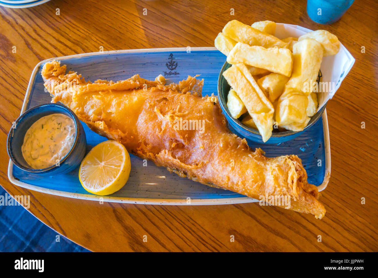 Excellent fish chips lemon and tartare sauce at The Star Inn Cafe in Whitby Stock Photo