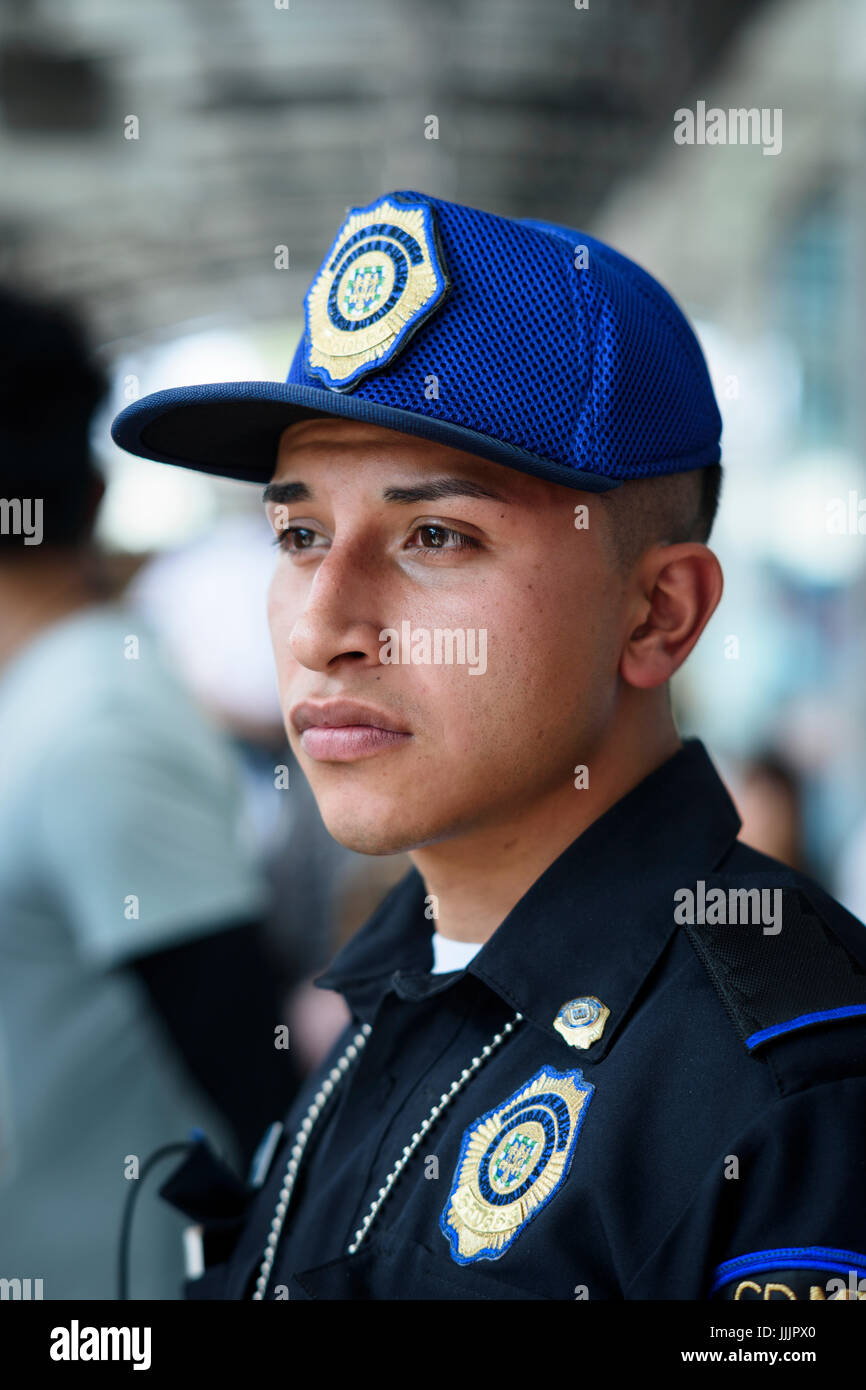 policeman guards metrobús station Stock Photo