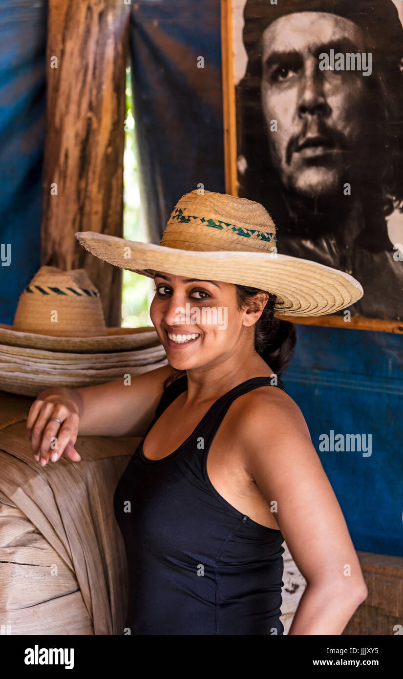 A tourist enjoys a visit to CASA MANOLO, famous for its organic cigars grown in the Vinales Valley - VINALES, CUBA Stock Photo